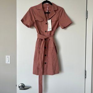 mauve dress, black buttons, and a tie front